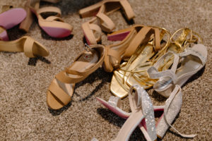 bride and bridesmaid shoes on the floor