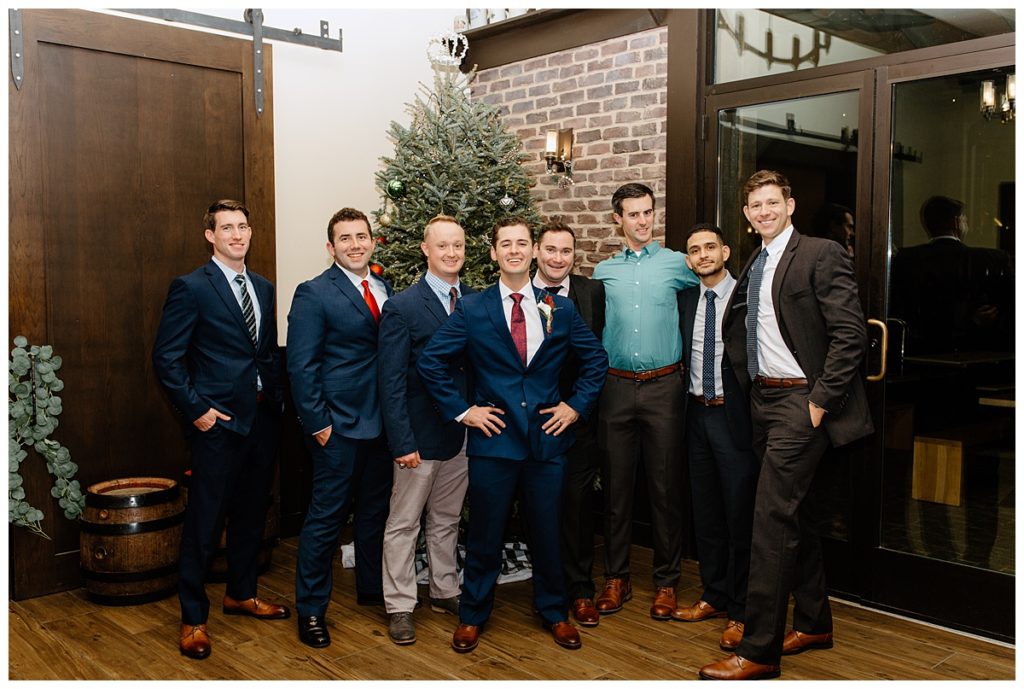 groom and his friends at chirstmas wedding reception in charlotte nc