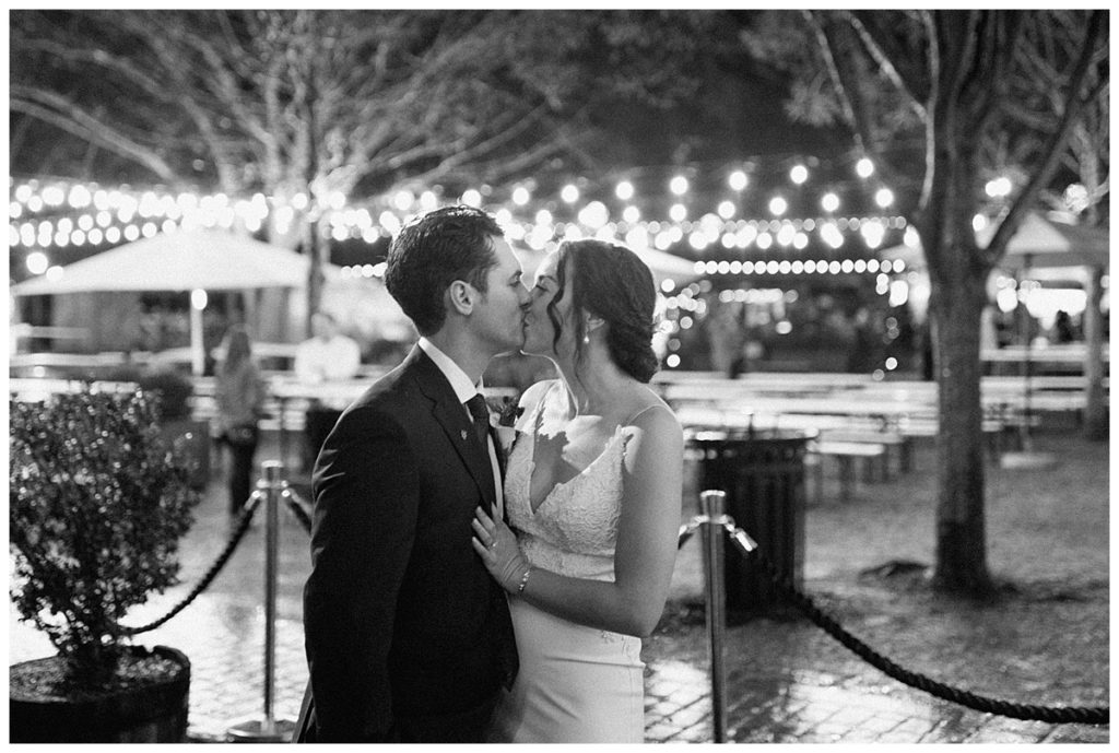bride and groom with string lights at olde meck brewery in charlotte nc