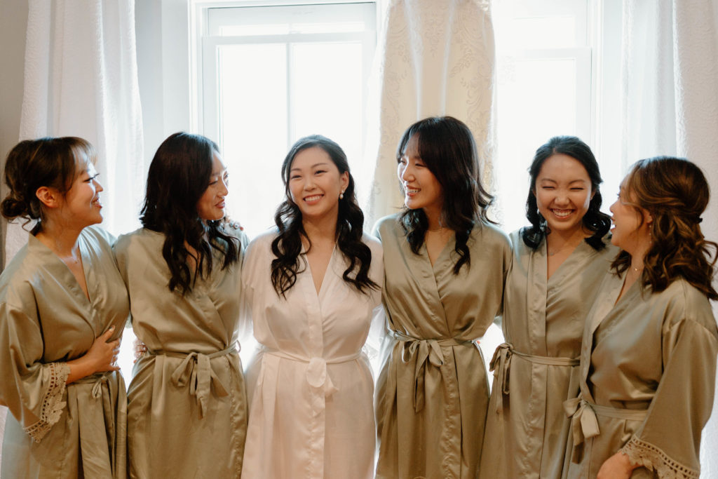 bride and bridesmaids in green robes