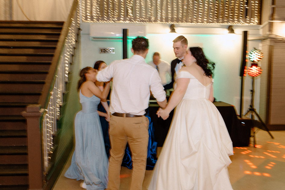 people dancing during wedding reception at wilburn lofts in downtown fayetteville