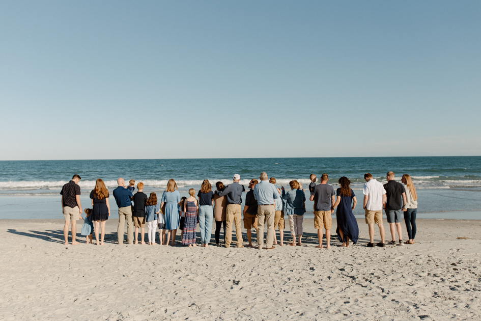 a family enjoying myrtle beach view during their family photos